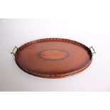 An Edwardian mahogany and shell inlaid oval tray, 58cm length