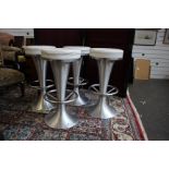 A set of four chrome bar stools