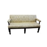 A mid 19th century mahogany upholstered sofa with rectangular back open arms on turned supports