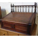 A 19th Century mahogany bible box with spindle gallery and sloping front