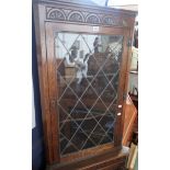 An oak full standing corner cupboard