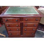 A mahogany desk with eight drawers and writing surface 74cm high, 83cm wide