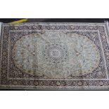 A green ground Kashan carpet 230 x 160cm