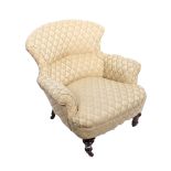 A Victorian style button back armchair