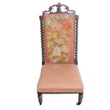 A Victorian mahogany needlework chair with barley twist supports on turned legs.