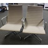 A pair of Eames for Vitra chrome framed lounge chairs