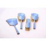 A silver and pale blue enamel brush set, Birmingham 1930, W. Neale & Son Ltd, comprising three