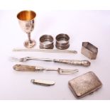 A collection of sterling silver items to include a George IV pickle fork with carved dendritic agate