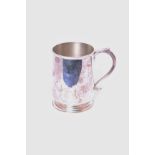 An Edwardian sterling silver mug, plain tapering form with S scroll handle, by John Edward Wilmot,