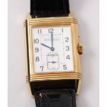 An 18ct gold Jaegar Le Coultre Reverso dual face gentleman's wrist watch, with traditional gadroons,