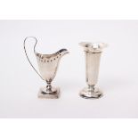 A sterling silver trumpet vase, Birmingham 1911; together with a square footed cream jug with