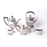 A five piece Edwardian sterling silver tea set by James Dixon & Son, Sheffield 1905, with sterling