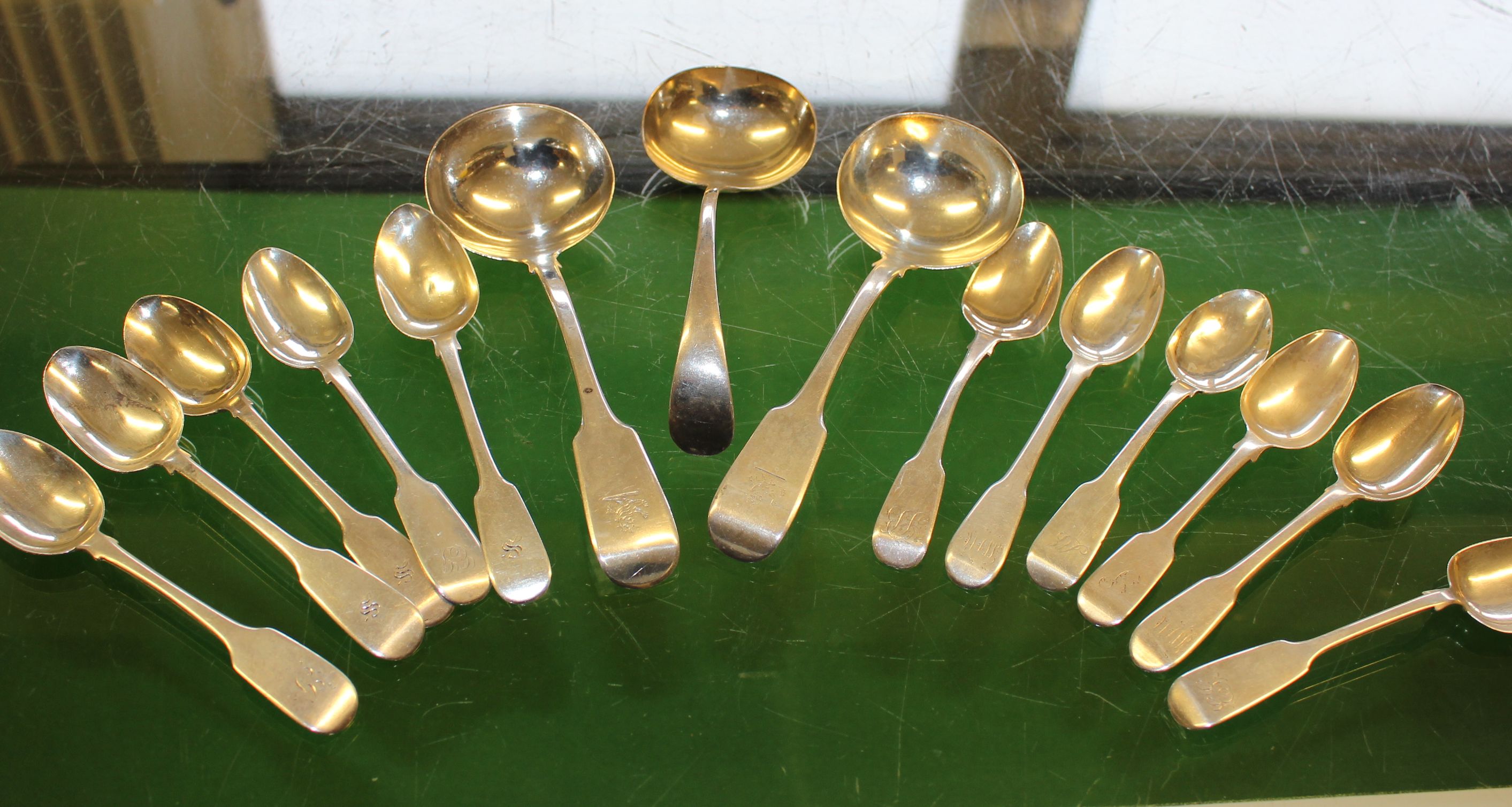 A collection of Victorian and later sterling silver flatware, to include eleven tea spoons and three