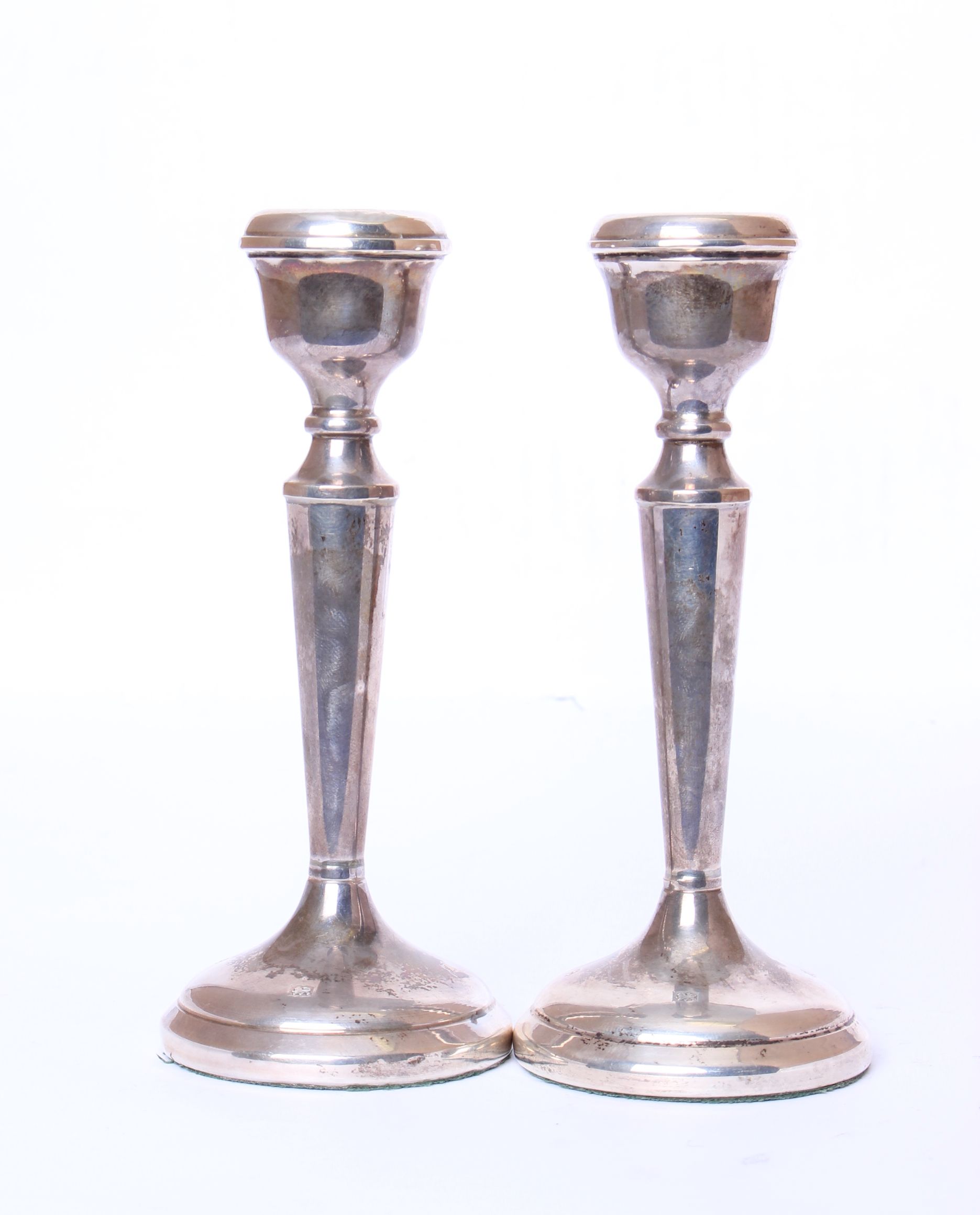 A pair of sterling silver candlesticks by P H Vogel & Co, Birmingham 1974, 6.40ozt gross.
