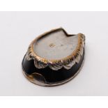A 19th Century silver plated horseshoe shaped vesta case, with gilt and black enamel decoration.