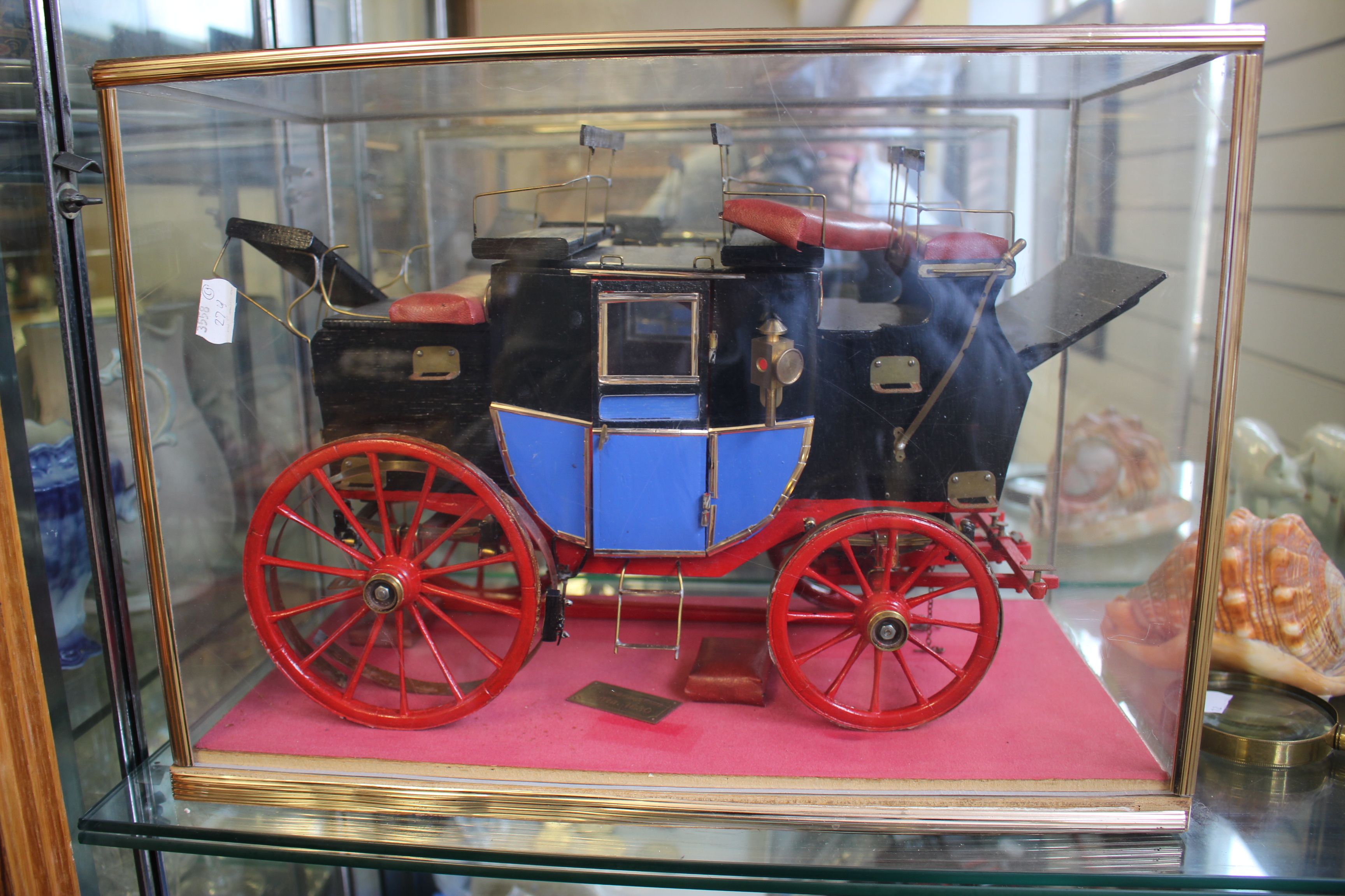 A cased model of an English coach carriage of circa 1830, 33.5cm wide, (modern)
