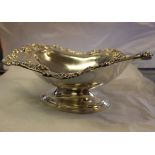 An American silver footed bowl, with cast floral rim in the 'Talisman Rose' pattern by Frank M.