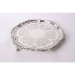 A Victorian silver salver with leaf and bead decorated border, the plate engraved with leaves and