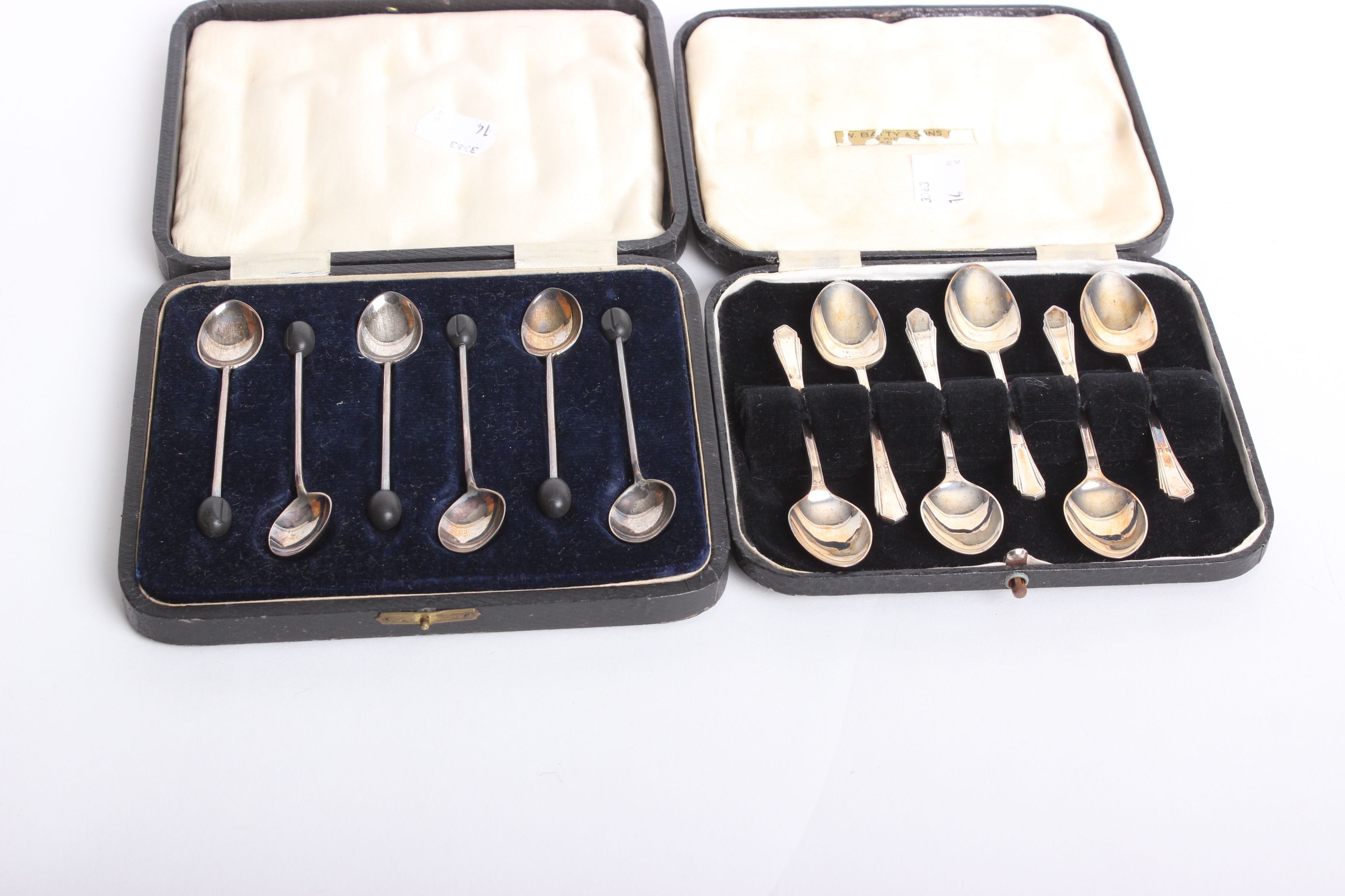 A cased set of six silver coffee spoons, Walker & Hall, Sheffield, 1925 and a further set (2)