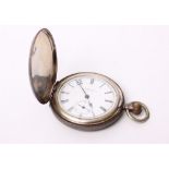 A sterling silver full hunter pocket watch, white enamel face with black Roman numeral markers,