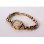 An 18ct gold ladies square faced cocktail watch by Consul, gold Arabic markers to a champagne