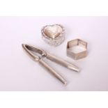 A pair of sterling silver handled nut crackers by Mappin & Webb; together with a heart shaped silver