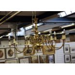 An Edwardian brass ten branch chandelier, with S-scroll brackets. Fitted for electricity. 112cm