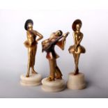 An Art Deco gilt metal figure of a ballerina, 27cm high; together with a similar model of a