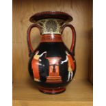 A Swansea Pottery style twin handled amphora shaped vase decorated with classical scene and Greek