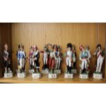 A set of thirteen 'Napoleonic' porcelain models of foot soldiers, each standing on a shaped base