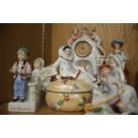 A Continental porcelain mantel timepiece; together with other Continental porcelain figurines.