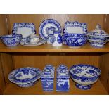 A large collection of blue and white pottery, including lidded tureens, bowls by Doulton Spode,