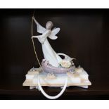 Lladro - a figure of a fairy ' The Enchanted Lake' No.07679, on oval mahogany base, 37cm high.