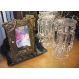 A pair of cut glass lustres together with a pair of brass Art Nouveau style picture frames.