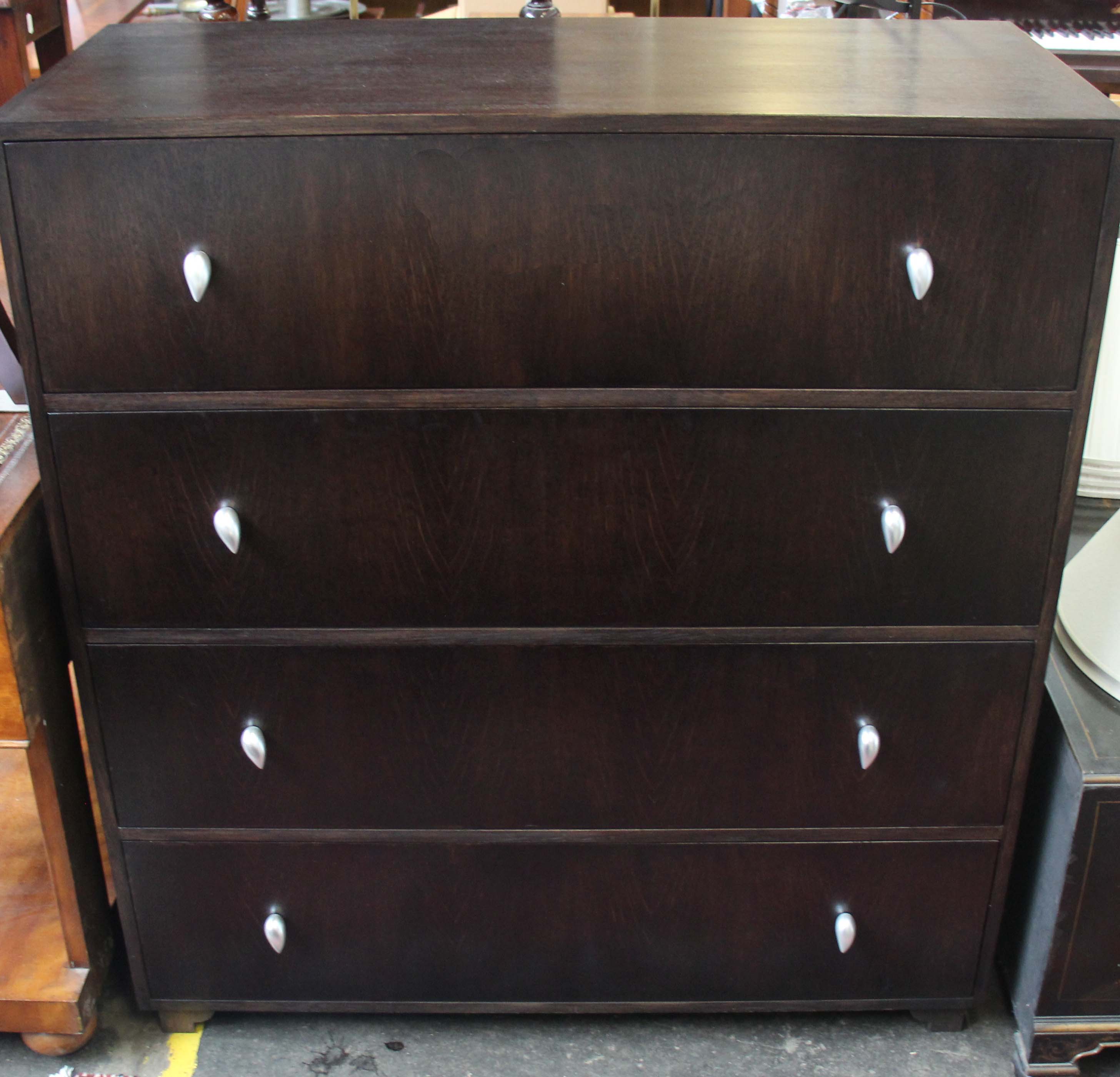 A stained oak chest of four drawers, 110cm wide.