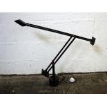 A modern black cantilever adjustable desk lamp.