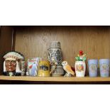 A Royal Doulton North American Indian character jug, a Wedgwood Rupert The Bear money box, Royal