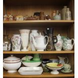 A collection of stoneware bottles, a Portmeirion baking dish, a group of Cottage Ware, a Copeland