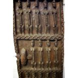 A North African decorative carved window shutter, 28 x 69cm