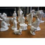 A pottery Nativity scene with gilt decoration together with a collection of place settings and