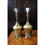 A pair of brass baluster shaped table lamps, 60cm high.