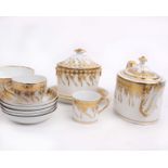 A Regency porcelain and gilt decorated tea and coffee service to include, slop bowl, caddy, coffee