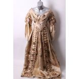 A 19th Century floral cream silk dress, with a pleated neckline, boned bodice with hook and silk