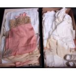 A quantity of early 20th Century lingerie and baby clothes, including silk and cotton slips,