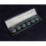 Set of six silver buttons within a velvet lined green leather case, with import marks for Samuel