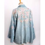 A 1920s pale blue silk kimono jacket with pale pink flowers; a dark mauve robe embroidered with gold