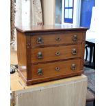 An Edwardian mahogany 3 drawer miniature/table top chest with mother of pearl decoration. 53cm(w)