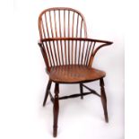 A 19th Century yew & elm Windsor armchair. 97cm(h) Yew back, arms sticks and front legs.
