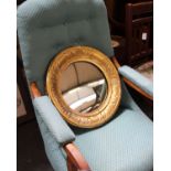 An Arts and Crafts circular convex wall mirror with gilt frame. 45cm(d)