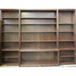A Continental walnut breakfront display unit, (modern), fitted with adjustable shelving between